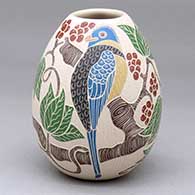 A polychrome jar decorated with a sgraffito-and-painted bird, branch, leaf and berry design
 by Guadalupe Melendez of Mata Ortiz and Casas Grandes