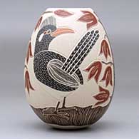 A polychrome jar decorated with a sgraffito-and-painted roadrunner, plant, leaf and flower design, click or tap to see a larger version