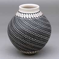 A polychrome jar decorated with a spiral fine line, checkerboard and geometric design
 by Jose Luis Perez of Mata Ortiz and Casas Grandes