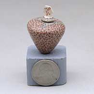 A miniature polychrome lidded jar decorated with a geometric design
 by Carla Martinez of Mata Ortiz and Casas Grandes