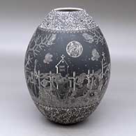 A black-on-white jar decorated with a band of sgraffito Night of the Dead at the Cemetery under a full moon with bands of geometric design above and below
 by Hector Javier Martinez of Mata Ortiz and Casas Grandes