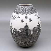 A black-on-white jar decorated with a band of a sgraffito Day of the Dead at the Cemetery design with geometric design above and below
 by Hector Javier Martinez of Mata Ortiz and Casas Grandes