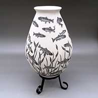 A black-on-white jar decorated with a sgraffito underwater scene of fish and plants
 by Adrian Corona of Mata Ortiz and Casas Grandes