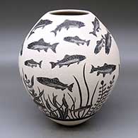 A black-on-white jar decorated with a sgraffito underwater scene of fish and plants
 by Adrian Corona of Mata Ortiz and Casas Grandes