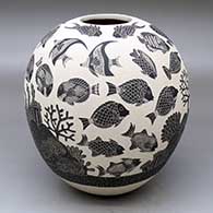 A black-on-white jar decorated with a sgraffito sea-creatures-and-coral-reef design
 by Adrian Corona of Mata Ortiz and Casas Grandes