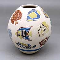 A polychrome jar decorated with a sgraffito tropical fish and jellyfish design
 by Adrian Corona of Mata Ortiz and Casas Grandes