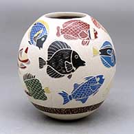 A polychrome jar decorated with a lightly-carved and sgraffito tropical fish and jellyfish design
 by Adrian Corona of Mata Ortiz and Casas Grandes