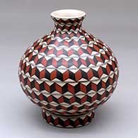 A polychrome thin-neck jar decorated with a 3D geometric design and with a matching custom stand
 by Oralia Lopez of Mata Ortiz and Casas Grandes