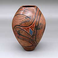 A polychrome mixed clay jar decorated with a carved and painted geometric design
 by Salvador Baca of Mata Ortiz and Casas Grandes