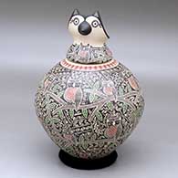 A polychrome jar decorated with a sgraffito-and-painted owl, branch, leaf and geometric design, with an owl head lid
 by Angela Corona of Mata Ortiz and Casas Grandes