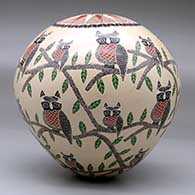 A polychrome seed pot decorated with a sgraffito owl, branch, leaf and geometric design, click or tap to see a larger version