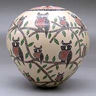 A polychrome seed pot decorated with a sgraffito owl, branch, leaf and geometric design, click or tap to see a larger version