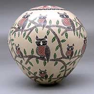 A polychrome seed pot decorated with a sgraffito owl, branch, leaf and geometric design, click or tap to see a larger version