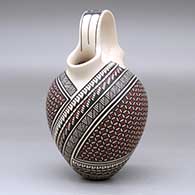 A polychrome wedding vase decorated with a two-panel geometric design, click or tap to see a larger version