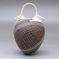 A polychrome wedding vase decorated with a two-panel geometric design, click or tap to see a larger version