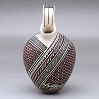 A polychrome wedding vase decorated with a two-panel geometric design, click or tap to see a larger version