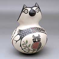 A polychrome owl figure jar decorated with a sgraffito-and-painted owl, branch and geometric design
 by Angela Corona of Mata Ortiz and Casas Grandes