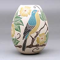A polychrome jar decorated with a sgraffito and painted bird, branch, leaf and flower design, click or tap to see a larger version