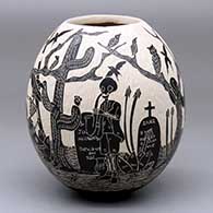 A black-on-white jar decorated with a Day of the Dead at the Cemetery in the desert design
 by Diana Loya of Mata Ortiz and Casas Grandes