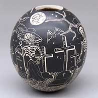 A black-on-white jar decorated with a sgraffito Night of the Dead at the Cemetery under the rabbit in the full moon design
 by Emiliano Rodriguez of Mata Ortiz and Casas Grandes