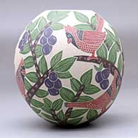 A polychrome jar decorated with a sgraffito-and-painted bird, branch, leaf and berry design, click or tap to see a larger version