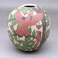 A polychrome jar decorated with a sgraffito-and-painted bird, branch, leaf and berry design
 by Karla Flores of Mata Ortiz and Casas Grandes