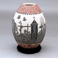 A polychrome jar decorated with a sgraffito Day of the Dead at the cemetery and geometric design
 by Hector Javier Martinez of Mata Ortiz and Casas Grandes