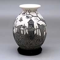 A black and white jar with a recurved neck and decorated with a sgraffito Day of the Dead at the cemetery design
 by Hector Javier Martinez of Mata Ortiz and Casas Grandes