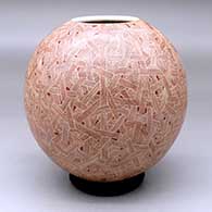 A red on white jar decorated with a sgraffito geometric design
 by Abel Lopez of Mata Ortiz and Casas Grandes