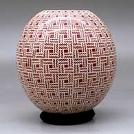 A red on white decorated with a sgraffito basket-weave geometric design, click or tap to see a larger version