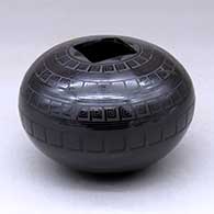 A black on black seed pot with a square opening and decorated with bands of geometric design
 by Ruben Rodriguez of Mata Ortiz and Casas Grandes