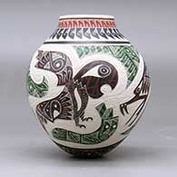A polychrome jar decorated with a sgraffito and painted parrot, dragonfly, serpent and geometric design, click or tap to see a larger version
