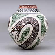 A polychrome jar decorated with a sgraffito and painted parrot, dragonfly, serpent and geometric design, click or tap to see a larger version