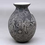 A black on white jar with a rolled lip and decorated with a sgraffito Night of the Dead at the Cemetery with Native Americans design
 by Hector Javier Martinez of Mata Ortiz and Casas Grandes