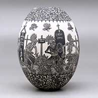 A black on white jar decorated with a sgraffito Day of the Dead at the cemetery with Native Americans design, click or tap to see a larger version