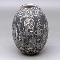 A black on white jar decorated with a sgraffito Night of the Dead at the Cemetery with Native Americans and geometric design
 by Hector Javier Martinez of Mata Ortiz and Casas Grandes