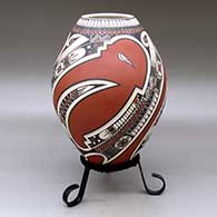 A polychrome jar lightly carved and painted with a three-panel serpent, sickle and geometric design
 by Lazaro Ozuna of Mata Ortiz and Casas Grandes
