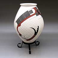 Click for a larger view A polychrome jar with a flared rim and decorated with a two-panel carved, sgraffito and painted serpent, checkerboard and geometric design
by Roberto Olivas of Mata Ortiz and Casas Grandes