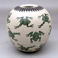 A polychrome jar decorated with a sgraffito and slipped frog and ring-of-feathers geometric design
 by Leonel Lopez Sr of Mata Ortiz and Casas Grandes