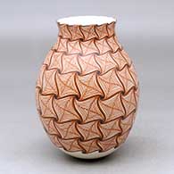 A polychrome vase decorated with a geometric design
 by Aide Gonzalez of Mata Ortiz and Casas Grandes