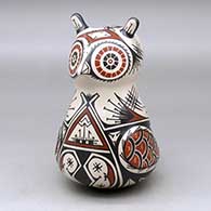 A polychrome owl effigy decorated with a bird element and geometric design
 by Jorge Corona of Mata Ortiz and Casas Grandes