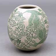 A polychrome jar decorated with a sgraffito bird, flower, leaf and vine design
 by Abel Lopez of Mata Ortiz and Casas Grandes