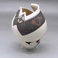 A polychrome jar with a geometric cut opening and decorated with a tiny square and geometric design
 by Diego Valles of Mata Ortiz and Casas Grandes