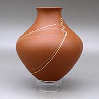 A polychrome jar with a recurved neck and decorated with a geometric design with a hummingbird hovering on the rim, click or tap to see a larger version