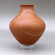 A polychrome jar with a recurved neck and decorated with a geometric design with a hummingbird hovering on the rim, click or tap to see a larger version