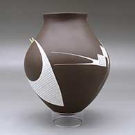 A white on brown jar with a recurved neck and decorated with a geometric design with a hummingbird hovering above the shoulder, click or tap to see a larger version