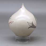 A polychrome tear drop jar decorated with a flower, leaf and geometric design plus an inlaid stone, click or tap to see a larger version