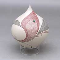 A polychrome tear drop jar decorated with a flower, leaf and geometric design plus an inlaid stone
 by Carla Martinez of Mata Ortiz and Casas Grandes