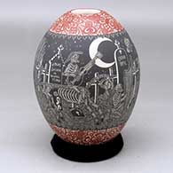 A polychrome jar decorated with a sgraffito Night of the Dead at the cemetery design
 by Hector Javier Martinez of Mata Ortiz and Casas Grandes