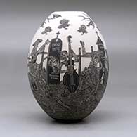 A black on white jar decorated with a sgraffito Day of the Dead at the cemetery design, click or tap to see a larger version